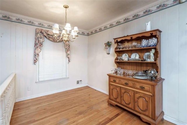 1526 N Cherokee Rd N, Social Circle, GA 30025 - dining space with a chandelier, ornamental molding, light wood-type flooring, and baseboards