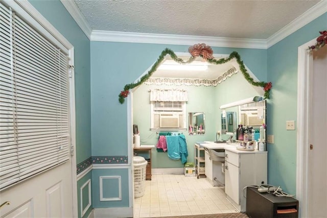 1526 N Cherokee Rd N, Social Circle, GA 30025 - bathroom with vanity, ornamental molding, and a textured ceiling