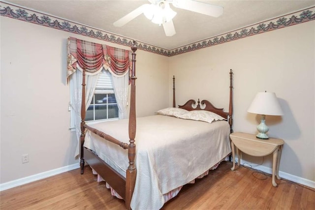 1526 N Cherokee Rd N, Social Circle, GA 30025 - bedroom featuring baseboards, wood finished floors, and ceiling fan