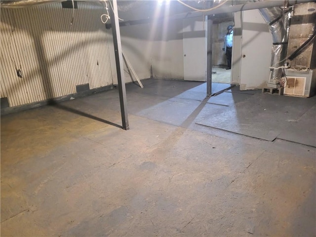 basement featuring heating unit