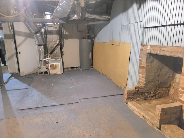 basement with water heater and heating unit