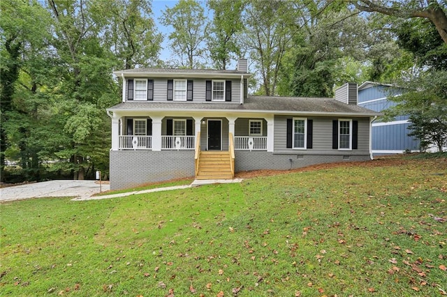 view of front of house featuring a front yard and covered porch