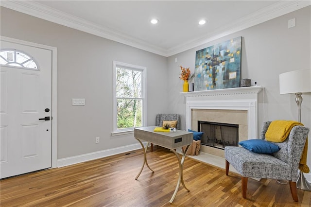 2453 Paul Ave NW, Atlanta, GA 30318 - foyer entrance with crown molding, wood finished floors, recessed lighting, and a fireplace with flush hearth