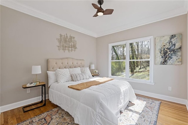 2453 Paul Ave NW, Atlanta, GA 30318 - bedroom with ornamental molding, wood finished floors, and a ceiling fan