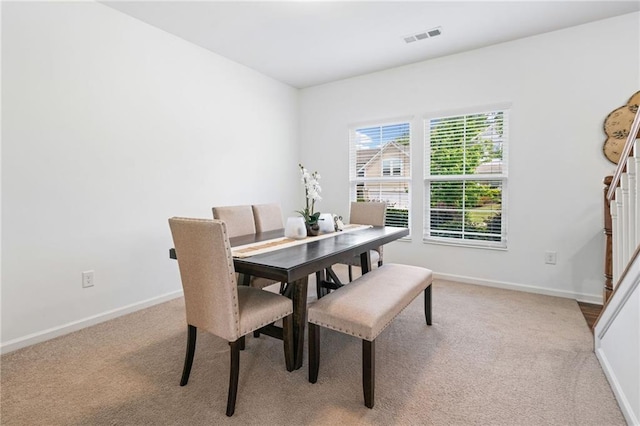 1560 Avalon Creek Rd, Sugar Hill, GA 30518 - carpeted dining area featuring baseboards and stairs