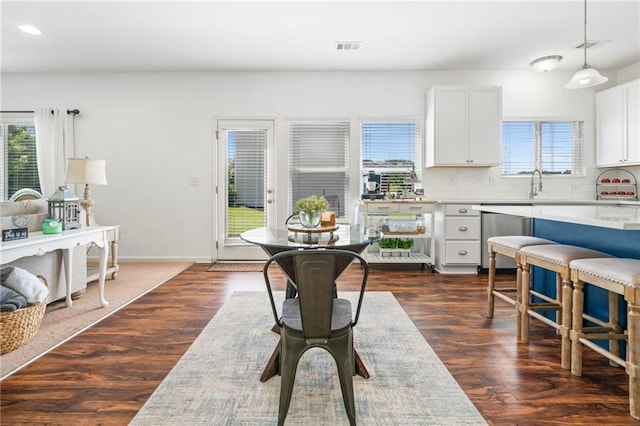 1560 Avalon Creek Rd, Sugar Hill, GA 30518 - kitchen with plenty of natural light, decorative backsplash, white cabinets, dark wood-style floors, and recessed lighting