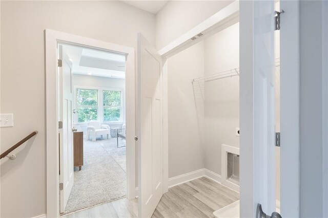 full bathroom featuring toilet, double vanity, washtub / shower combination, and a sink