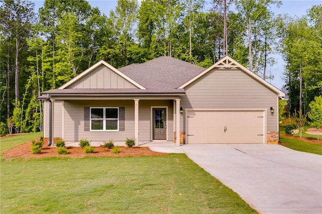 8971 Callaway Dr, Winston, GA 30187 - view of front facade featuring board and batten siding, a porch, a front yard, concrete driveway, and an attached garage