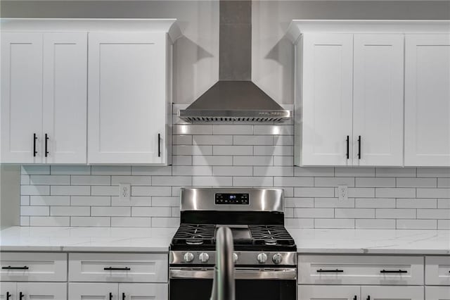 8971 Callaway Dr, Winston, GA 30187 - kitchen featuring wall chimney exhaust hood, white cabinets, and stainless steel gas range