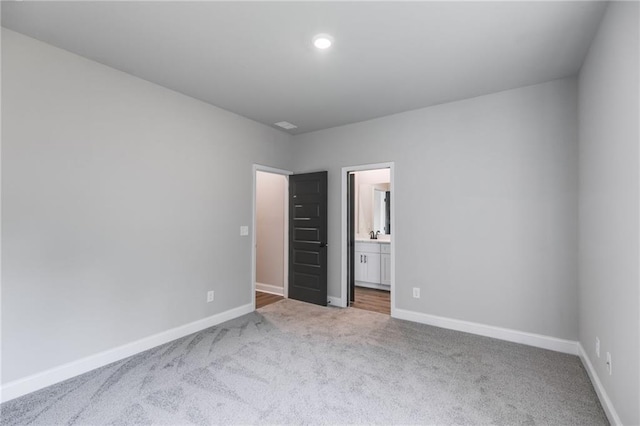 8971 Callaway Dr, Winston, GA 30187 - unfurnished bedroom with recessed lighting, baseboards, carpet flooring, and ensuite bath