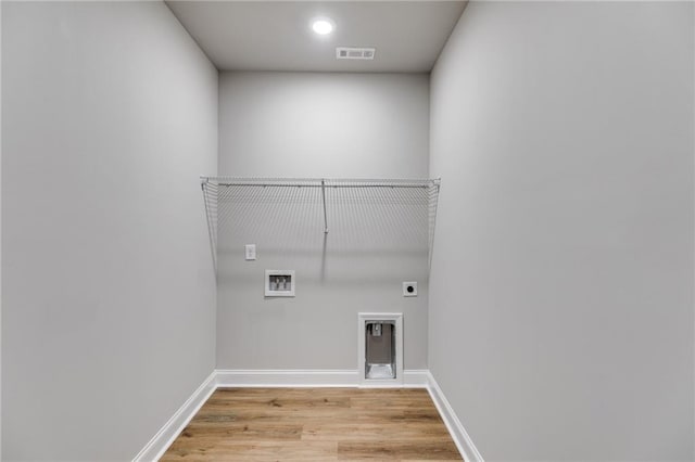 8971 Callaway Dr, Winston, GA 30187 - washroom with laundry area, light wood-style floors, hookup for a washing machine, hookup for an electric dryer, and visible vents