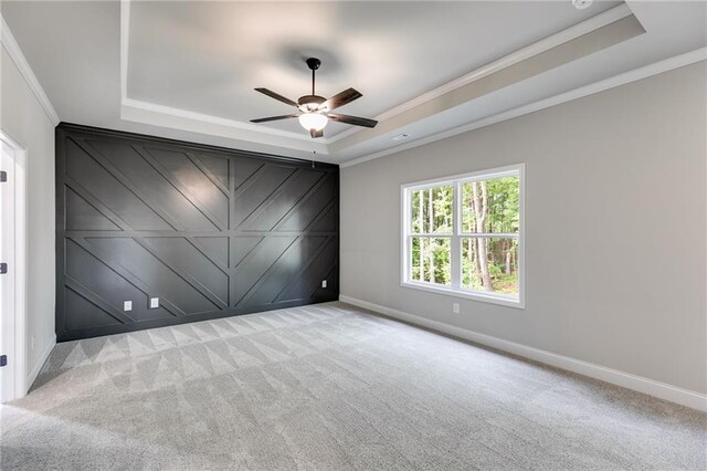 8971 Callaway Dr, Winston, GA 30187 - carpeted spare room with crown molding, ceiling fan, baseboards, and a raised ceiling