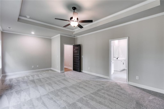 8971 Callaway Dr, Winston, GA 30187 - unfurnished bedroom featuring crown molding, baseboards, a tray ceiling, and light carpet