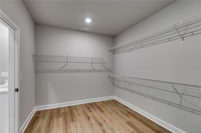 8971 Callaway Dr, Winston, GA 30187 - spacious closet featuring visible vents and wood finished floors