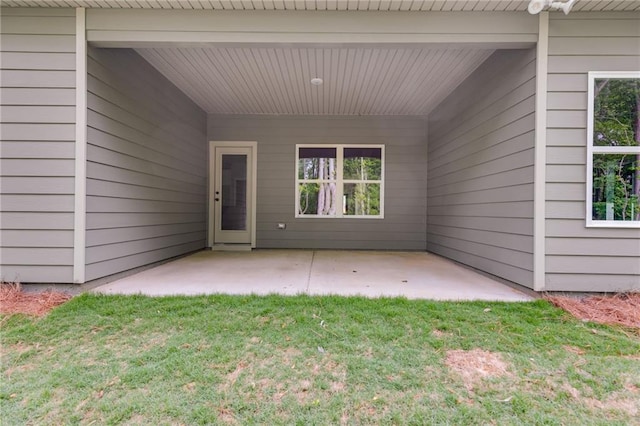 8971 Callaway Dr, Winston, GA 30187 - view of exterior entry with a lawn and a patio area