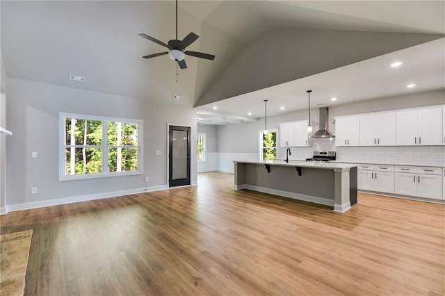 8971 Callaway Dr, Winston, GA 30187 - kitchen featuring open floor plan, wall chimney range hood, stainless steel electric range, white cabinets, and a ceiling fan
