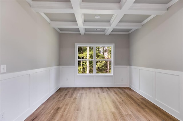 8971 Callaway Dr, Winston, GA 30187 - empty room with coffered ceiling, wainscoting, light wood-type flooring, and beam ceiling