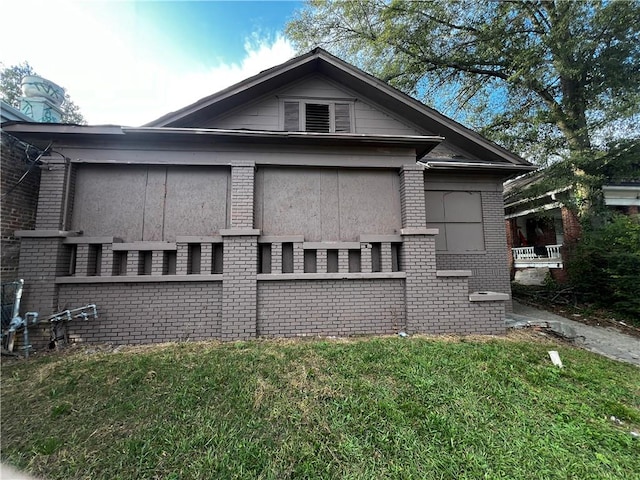 view of property exterior with a lawn