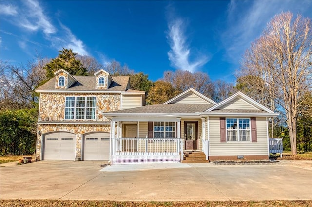 view of front of home featuring a garage and a porch