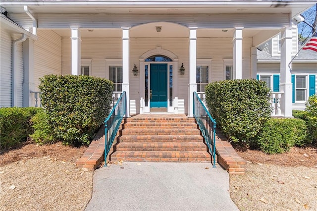 doorway to property featuring a porch