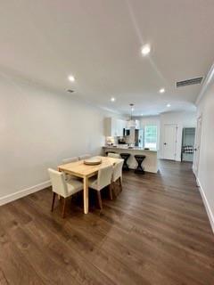 bathroom featuring ceiling fan, vanity, wood-type flooring, and walk in shower