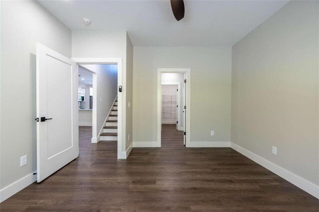 bathroom featuring walk in shower, vanity, hardwood / wood-style flooring, and ceiling fan