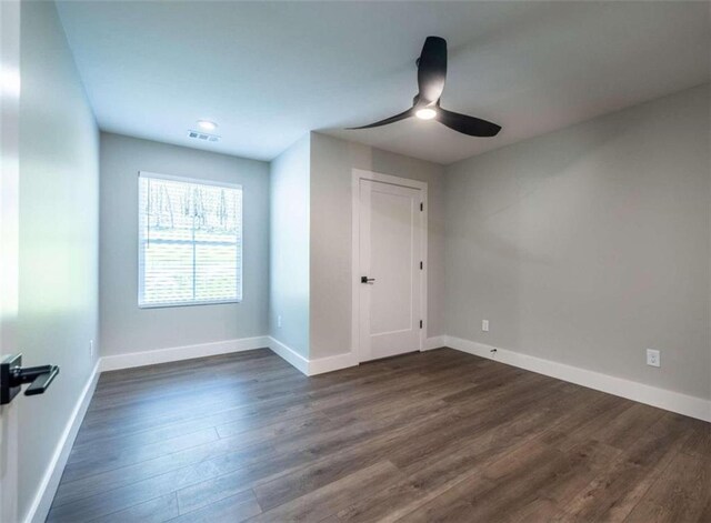 sitting room featuring lofted ceiling and dark wood-type flooring