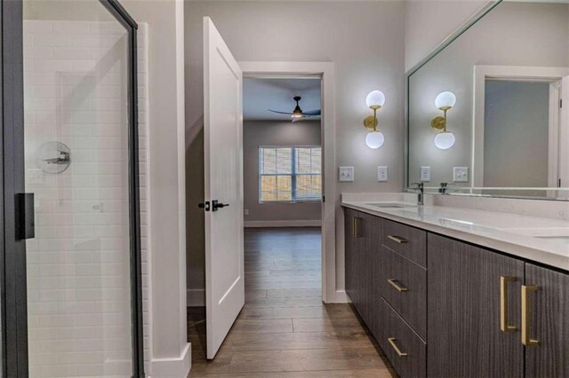 bathroom with bathtub / shower combination, vanity, and hardwood / wood-style flooring