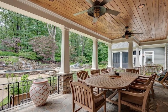 view of patio featuring ceiling fan and covered porch