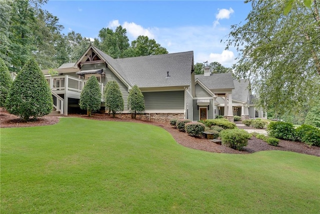 rear view of house with a lawn