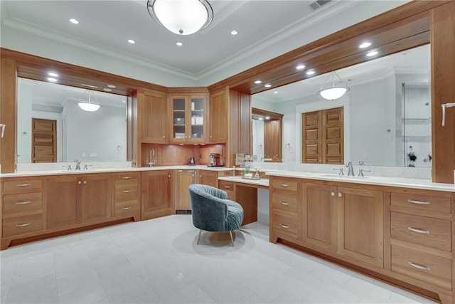 bathroom with ornamental molding, vanity, and tasteful backsplash