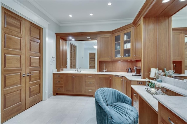 bathroom with ornamental molding and sink