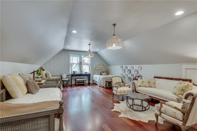 living room with vaulted ceiling, dark wood-type flooring, and a chandelier