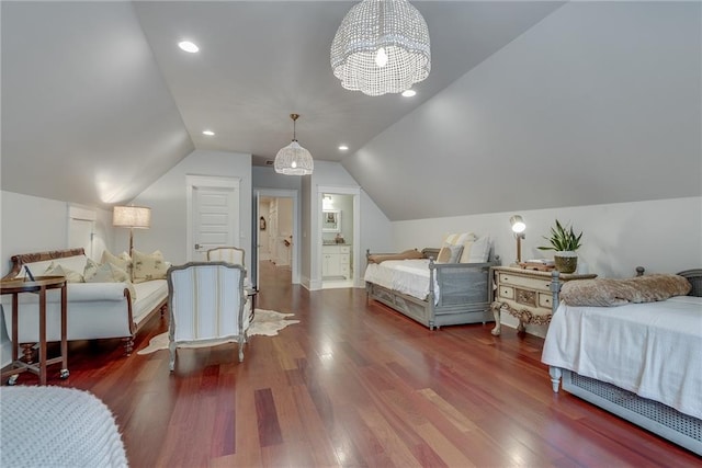 bedroom with lofted ceiling, dark wood-type flooring, and a chandelier