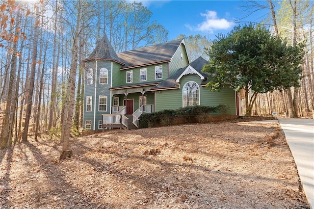 victorian house featuring covered porch