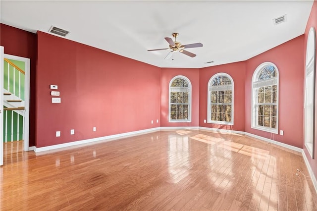 unfurnished room featuring ceiling fan and light hardwood / wood-style flooring