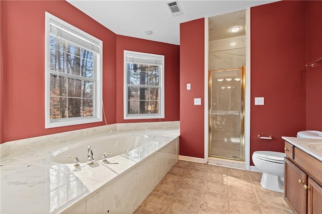 full bathroom with tile patterned floors, vanity, toilet, and independent shower and bath