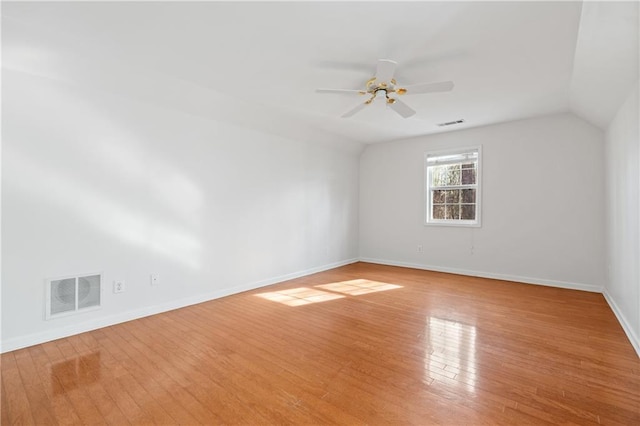 unfurnished room featuring ceiling fan, light hardwood / wood-style floors, and vaulted ceiling