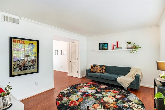 living room featuring crown molding and hardwood / wood-style floors