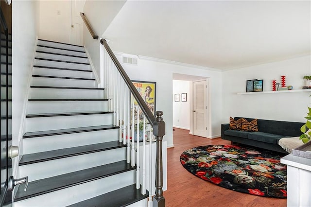 living room featuring crown molding and hardwood / wood-style floors