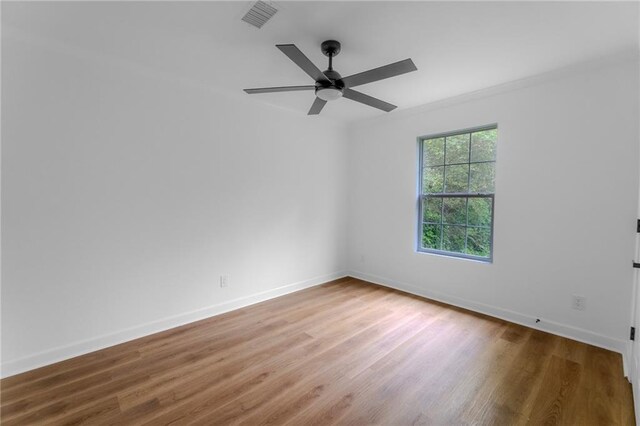 1111 Osborne St SW, Atlanta, GA 30310 - spare room featuring wood finished floors, visible vents, ornamental molding, baseboards, and ceiling fan