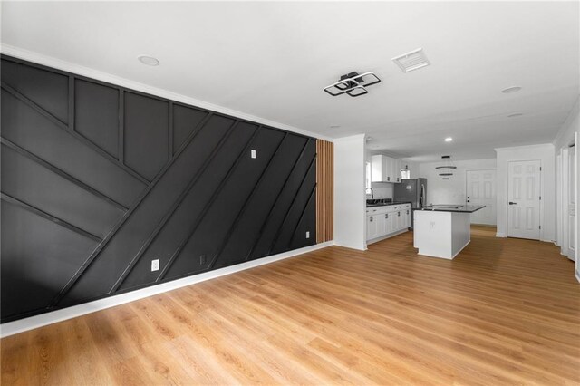 1111 Osborne St SW, Atlanta, GA 30310 - unfurnished living room featuring light wood-type flooring and a sink