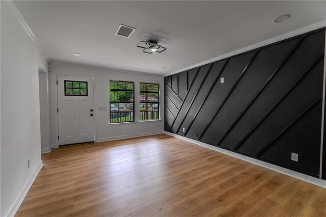 1111 Osborne St SW, Atlanta, GA 30310 - entryway featuring baseboards, crown molding, light wood finished floors, and visible vents