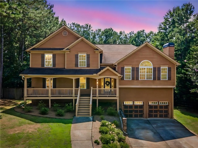 412 Gray Fox Dr, Canton, GA 30114 - view of front of property with a porch, concrete driveway, an attached garage, a chimney, and stairway