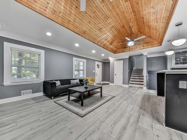 living room with light wood-type flooring, wood ceiling, crown molding, and vaulted ceiling