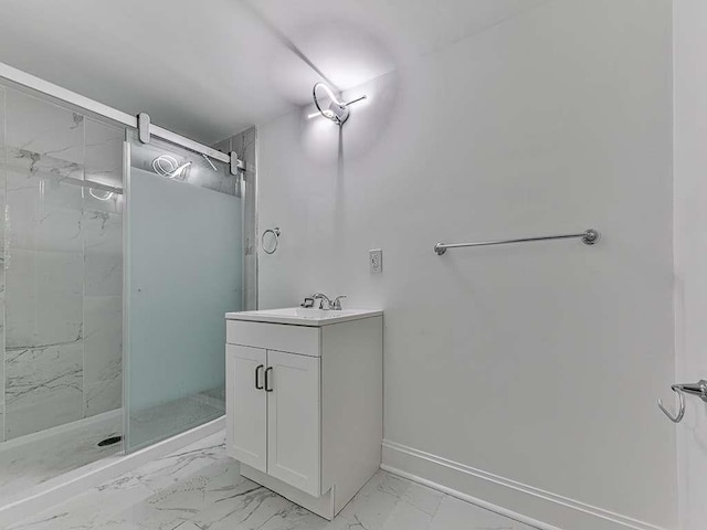 bathroom with a shower with door and vanity