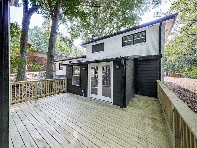 wooden deck featuring french doors