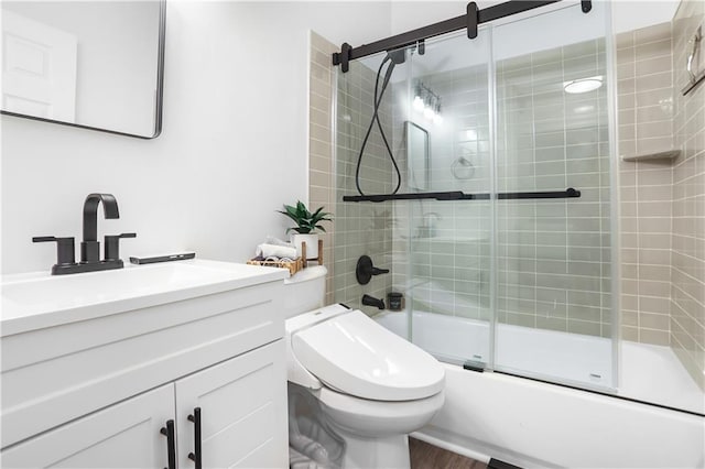 3675 Peachtree Rd NE Unit 24, Atlanta, GA 30319 - bathroom with vanity, enclosed tub / shower combo, and wood finished floors