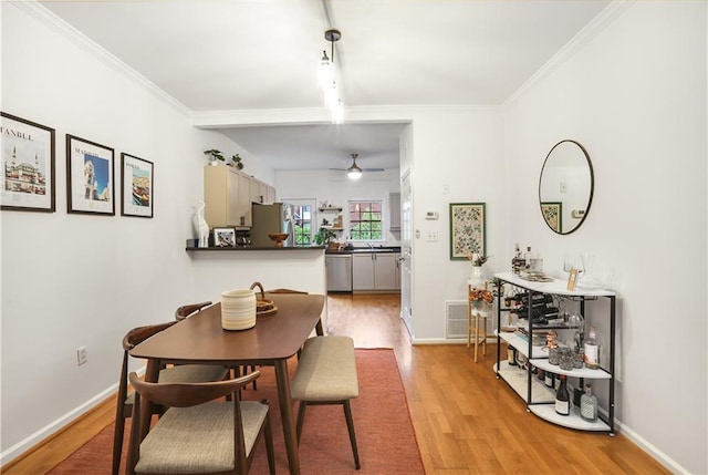 3675 Peachtree Rd NE Unit 24, Atlanta, GA 30319 - dining space featuring ceiling fan, light wood-style flooring, and crown molding