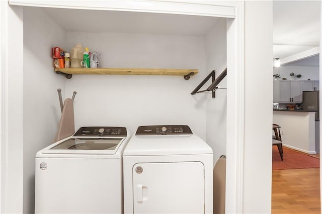 3675 Peachtree Rd NE Unit 24, Atlanta, GA 30319 - laundry area with washing machine and dryer and light wood-style floors